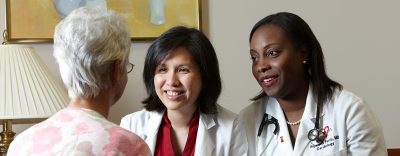 women cardiologists with patient